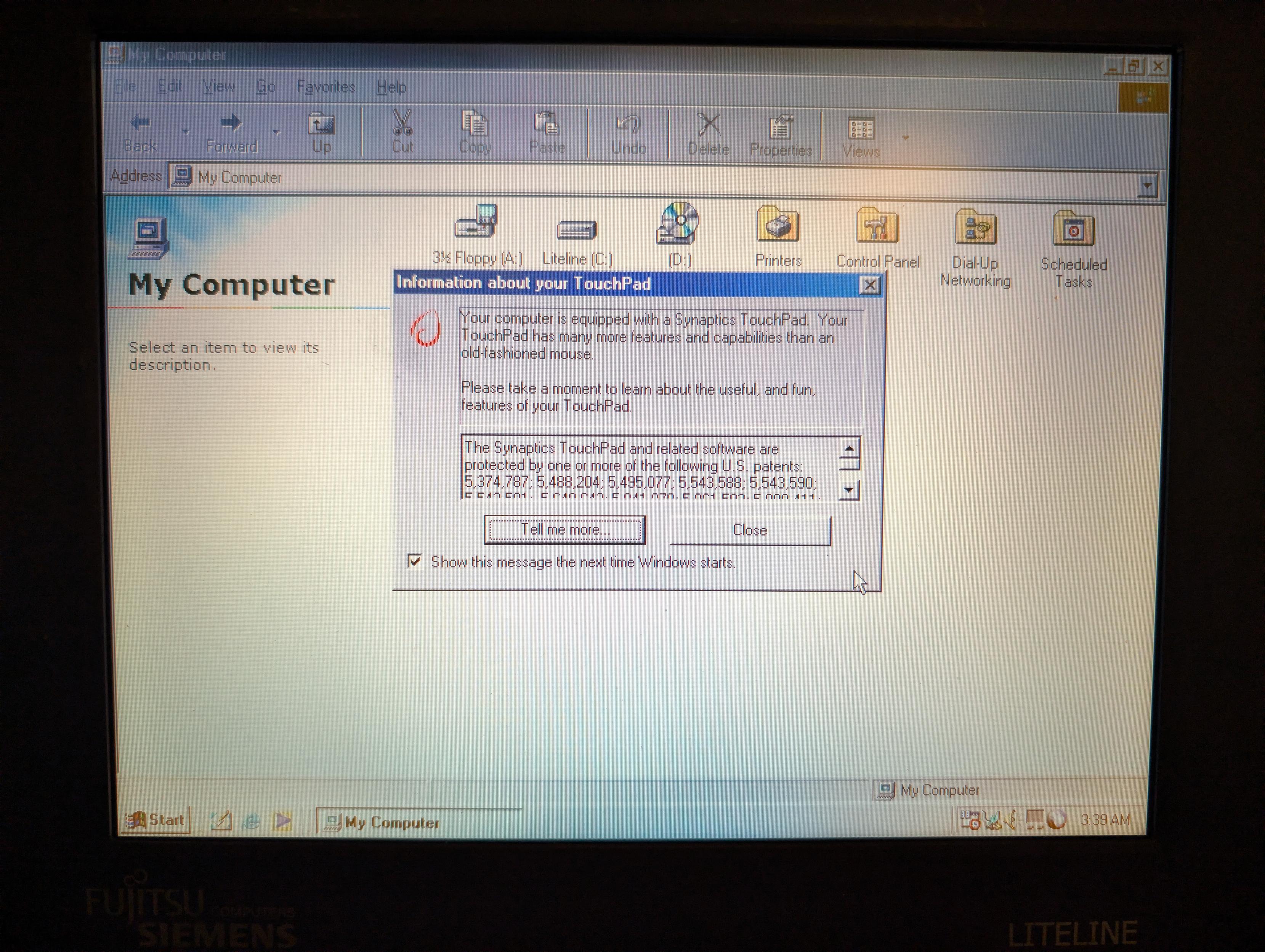 A picture of an old computer screen.. It says "your computer is equipped with a synaptics touchpad. Your touchpad has many more features and capabilities than an old-fashioned mouse.

Please take a moment to learn about the useful, and fun, features of your touchpad.

There's a checkbox to show this at each startup